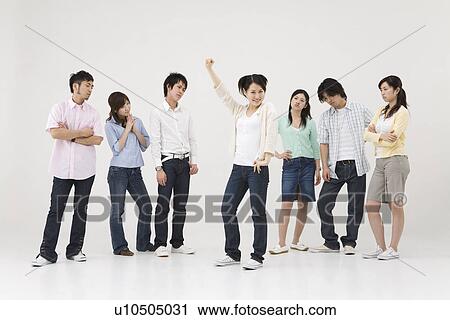 Young woman raising her arm View Large Photo Image Stock Image - Young woman raising her arm. Fotosearch