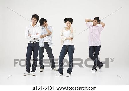 Young woman standing among three men View Large Photo Image Stock Image - Young woman standing among three men. Fotosearch
