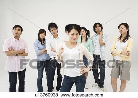 Stock Photo - Young woman standing confident. Fotosearch