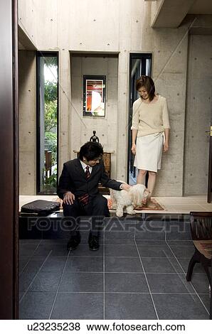Stock Photo - Businessman leaving for work. Fotosearch