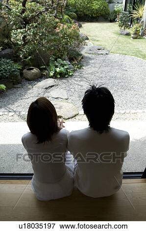 Stock Photo - Couple sitting on veranda. Fotosearch