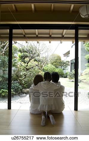 Family sitting on veranda View Large Photo Image Stock Photo - Family sitting on veranda. Fotosearch