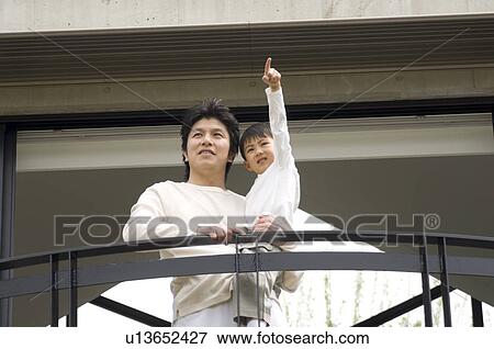 Stock Photo - Father holding son. Fotosearch