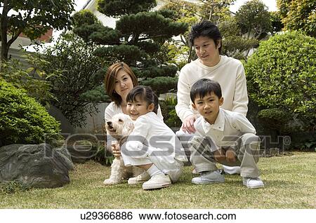 Stock Photograph - Portrait of family with two children. Fotosearch