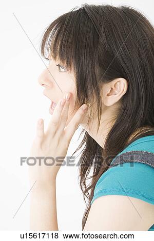 Portrait of young woman calling View Large Photo Image Stock Photo - Portrait of young woman calling. Fotosearch