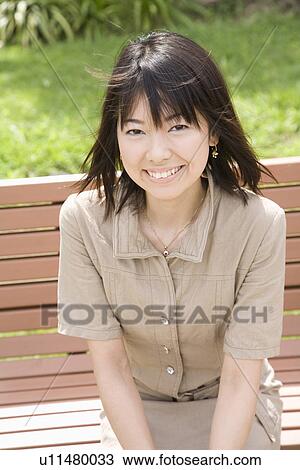 Stock Image - Portrait of young woman. Fotosearch