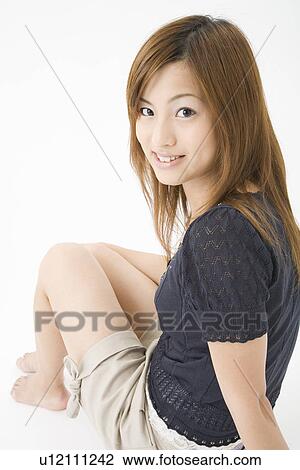 Stock Image - Portrait of young woman. Fotosearch