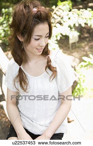 Stock Image - Portrait of young woman. Fotosearch