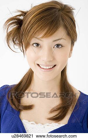 Stock Image - Portrait of young woman. Fotosearch