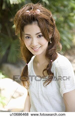 Stock Photo - Portrait of young woman. Fotosearch