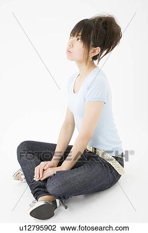 Young woman sitting View Large Photo Image Stock Image - Young woman sitting. Fotosearch