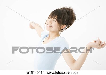Picture - Young woman stretching. Fotosearch