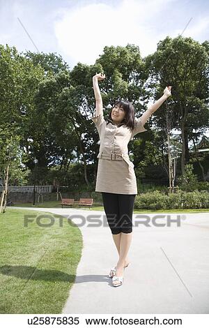Stock Photography - Young woman stretching. Fotosearch