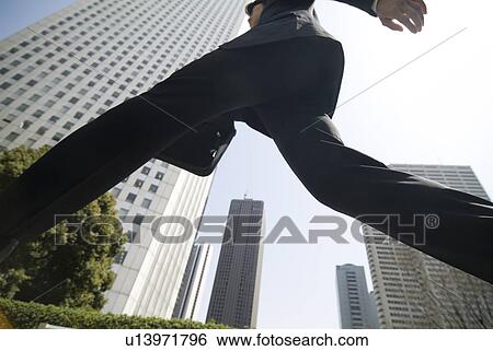 Stock Photograph - Businessman walking. Fotosearch