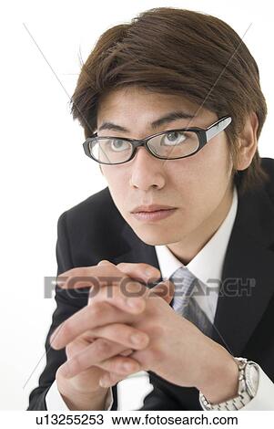 Stock Image - Portrait of young businessman. Fotosearch
