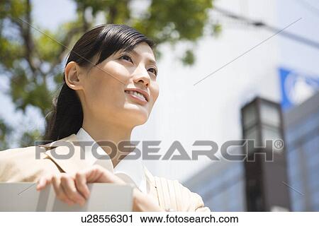 Stock Image - Portrait of young businesswoman. Fotosearch