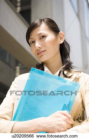 Stock Photograph - Portrait of young businesswoman. Fotosearch