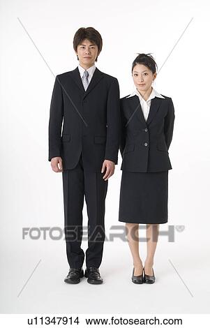 Portrait of young couple wearing suit View Large Photo Image Picture - Portrait of young couple wearing suit. Fotosearch