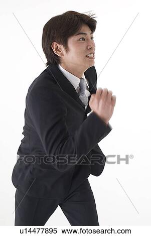 Stock Photography - Young businessman running. Fotosearch