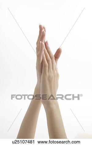 Stock Image - Hands of young woman. Fotosearch