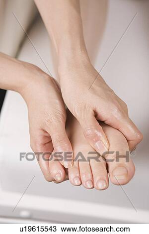 Massage therapist applying foot massage View Large Photo Image Stock Image - Massage therapist applying foot massage. Fotosearch