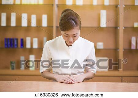 Stock Photograph - Receptionist welcoming guest. Fotosearch