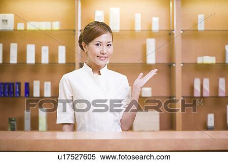 Stock Photography - Receptionist welcoming guest. Fotosearch