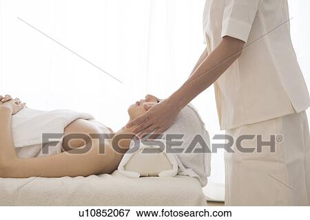 Young woman having facial massage View Large Photo Image Stock Photo - Young woman having facial massage. Fotosearch