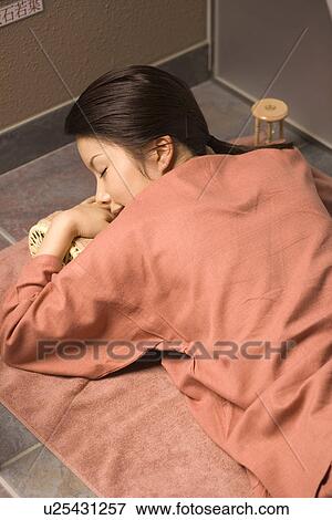 Young woman lying at bedrock bath View Large Photo Image Stock Photo - Young woman lying at bedrock bath. Fotosearch