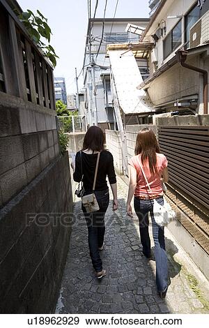 Two women walking in Kagurazaka, Tokyo, Japan View Large Photo Image Stock Photo - Two women walking in Kagurazaka, Tokyo, Japan. Fotosearch