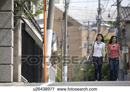 Stock Photo - Two women walking in Kagurazaka, Tokyo, Japan. Fotosearch