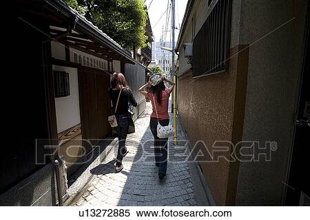 Stock Photography - Two women walking in Kagurazaka, Tokyo, Japan. Fotosearch