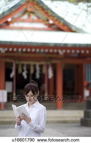 Young woman reading book View Large Photo Image Stock Image - Young woman reading book. Fotosearch