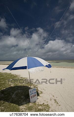 Beach umbrella in Taketomi Island, Okinawa Prefecture, Japan View Large Photo Image Picture - Beach umbrella in Taketomi Island, Okinawa Prefecture, Japan. Fotosearch