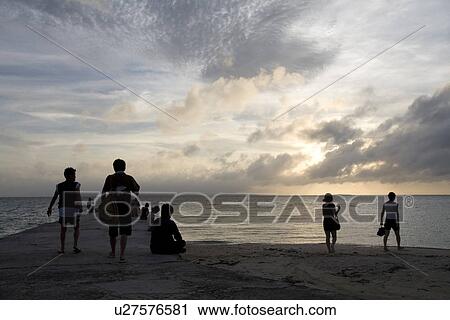 People sitting in pier View Large Photo Image Stock Image - People sitting in pier. Fotosearch