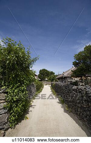 Stock Image - Street in Taketomi Island, Okinawa, Japan. Fotosearch