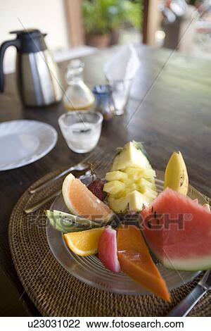 Stock Image - Tropical fruits in plate. Fotosearch