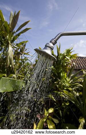 Stock Image - Water falling from shower head. Fotosearch