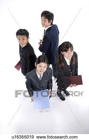 Four middle school students standing View Large Photo Image Stock Photo - Four middle school students standing. Fotosearch