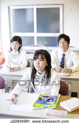 Stock Image - Middle school students studying. Fotosearch