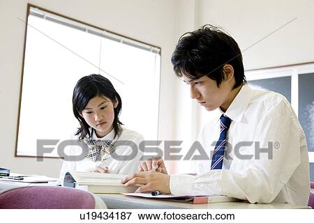 Stock Photo - Middle school students studying. Fotosearch
