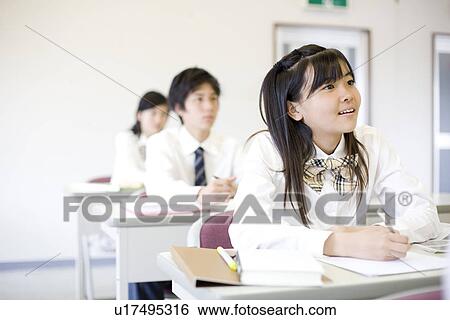 Stock Photograph - Middle school students studying. Fotosearch
