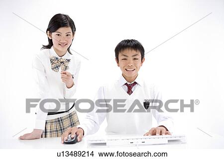 Middle school students using computer View Large Photo Image Picture - Middle school students using computer. Fotosearch