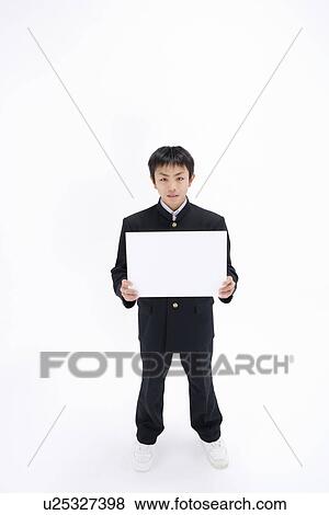 Stock Photo - Teenage boy holding blank message board. Fotosearch