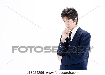 Stock Photograph - Teenage boy thinking. Fotosearch