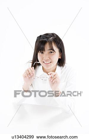 Teenage girl holding glasses View Large Photo Image Stock Photo - Teenage girl holding glasses. Fotosearch
