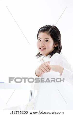 Teenage girl sitting View Large Photo Image Stock Image - Teenage girl sitting. Fotosearch