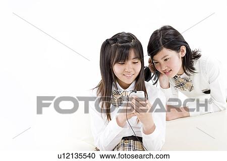 Teenage girls listening to music View Large Photo Image Stock Image - Teenage girls listening to music. Fotosearch