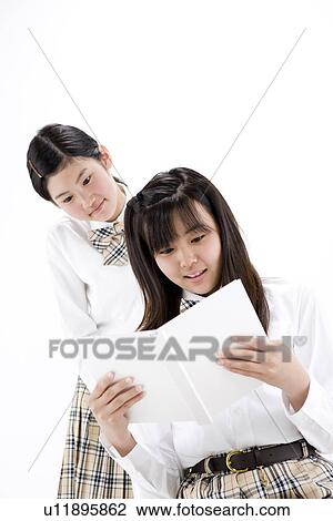 Teenage girls reading book View Large Photo Image Stock Image - Teenage girls reading book. Fotosearch
