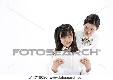 Teenage girls reading book View Large Photo Image Stock Image - Teenage girls reading book. Fotosearch